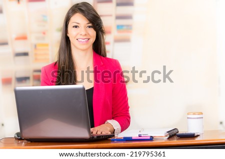 Beautiful young brunette girl student businesswoman professional working with laptop