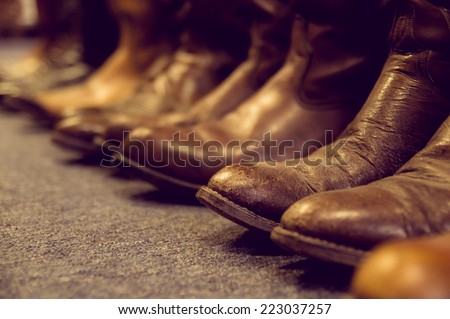 brown vintage leather boots aligned selective focus