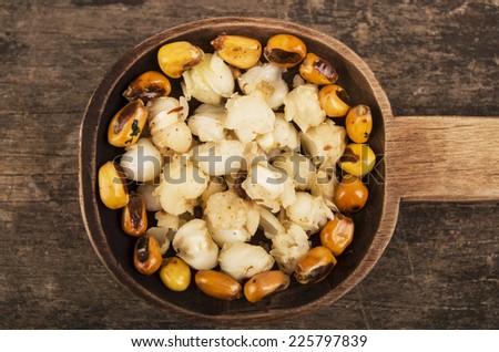 hominy and toasted corn nuts mote with tostado on wooden spoon ecuadorian traditional food