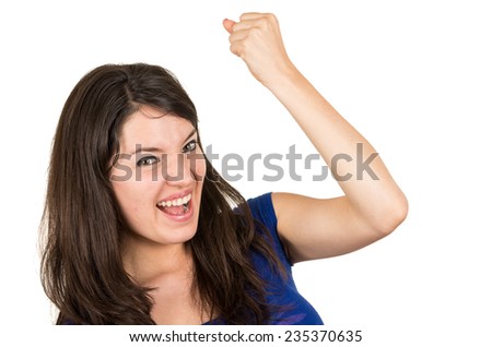 closeup portrait of beautiful young girl posing gesturing yes winning victory isolated on white