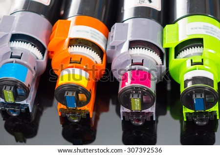Photocopier printer cartridges cmyk close up shot