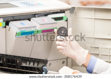 closeup shot technician fixing digital photocopier machine