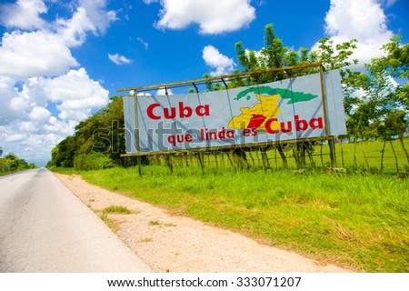 CENTRAL ROAD, CUBA - SEPTEMBER 06, 2015: Communist propaganda billboard in the rural highway system