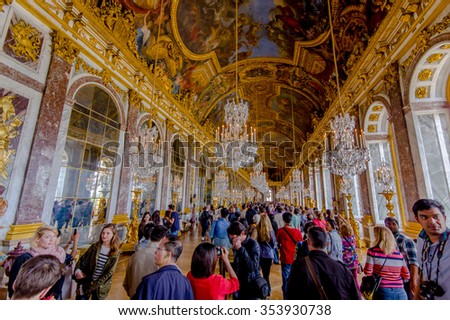 Paris, France - June 1, 2015: Crowds of tourists visiting the impressive and beautiful Hall of Mirrors in Palace of Versailles.
