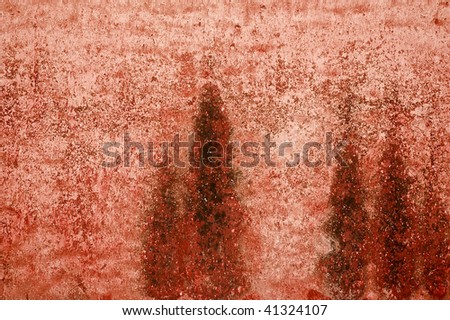 Random red, pink and black grunge background with multiple layers, stains and cracks.