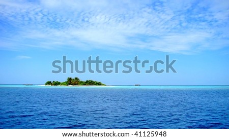 A small desert island at the Maldives