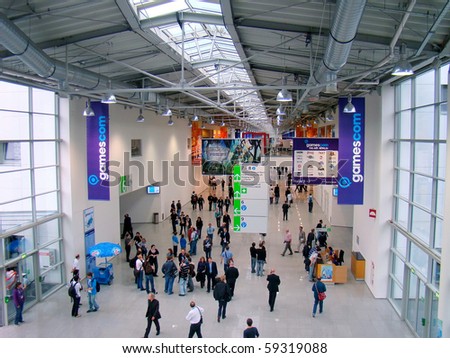 COLOGNE, GERMANY - AUGUST 18: People start crowding the Gamescom fair on August 18, 2010 in Cologne. Gamescom is a European trade fair for interactive games and entertainment.