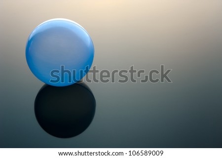 Colored ball on the dark surface