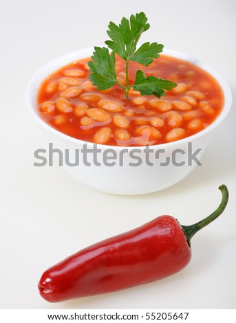 Bowl of chili with pepper and beans
