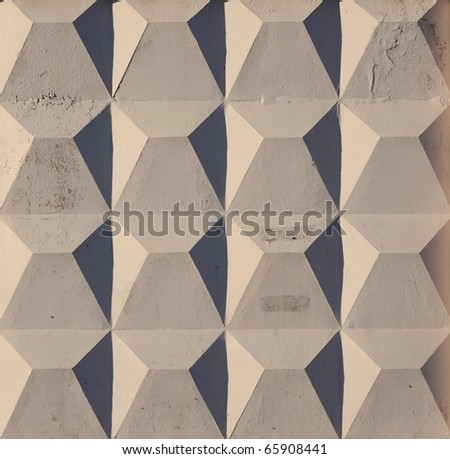 Concrete fence - a geometric background. Illuminated by the setting sun