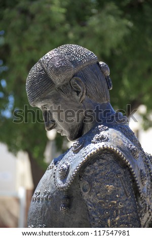 Statue of matador NimeÃ?Â?Ã?Â±o II in front of Roman Amphitheater in Nimes, France