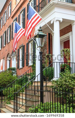 Colonial Red Brick Architecture with American Flags