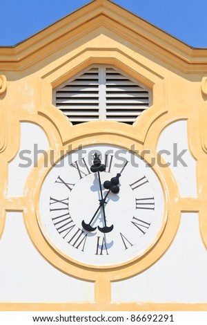 Ancient Clock on old building (with blue sky)