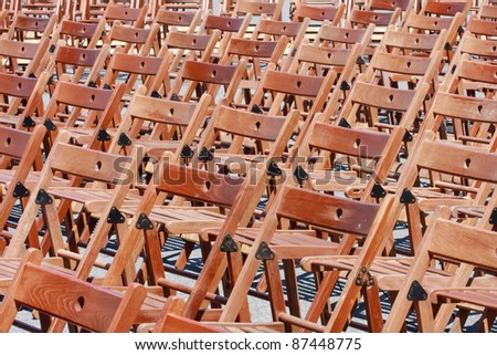Wooden chairs before concert (pattern / empty / no people)