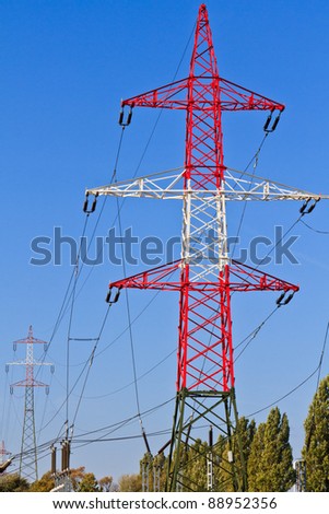 Electrical Tower / Utility Pole / Power Pole before cloudy blue sky