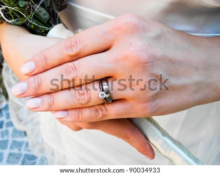 stock photo Bride wearing her diamond and wedding rings