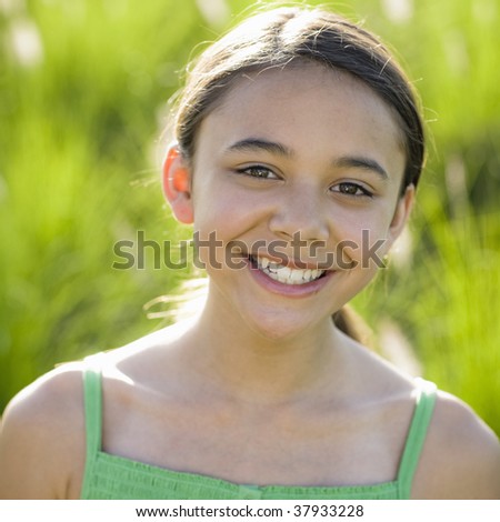 Portrait Of Tween Girl Smiling To Camera