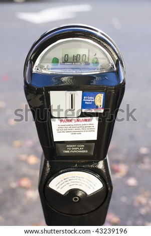 Closeup of a Black parking Meter With One Hour on The Clock