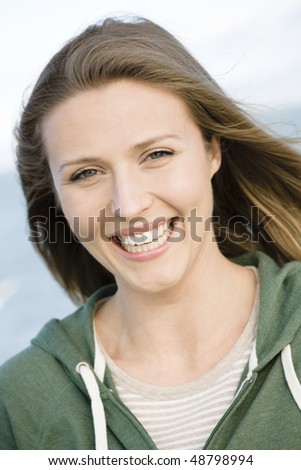 Portrait of a Pretty Young Woman Smiling To Camera