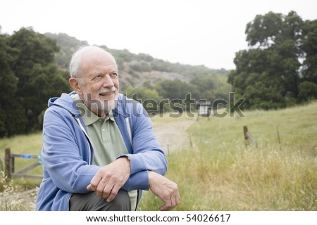 Old Man With a Beard Resting at the End of a Nature Trail
