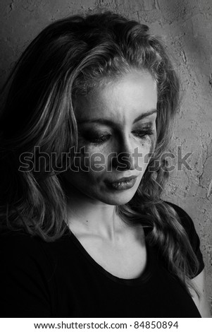 emotional portrait of a young  crying  girl (black and white shoot)