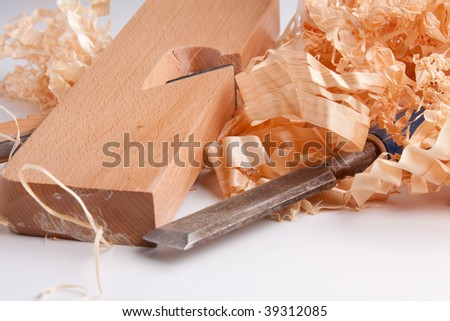 carpenters plane , wooden chips and wood isolated - stock photo