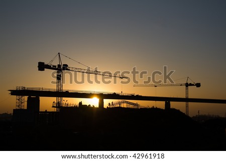 Two cranes and construction flyover