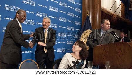 WASHINGTON, DC - OCTOBER 31: Republican Presidential contender Herman Cain is congratulated by campaign manager Mark Block after a speech at the National Press Club, October 31, 2011 in Washington, DC