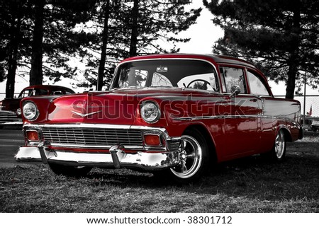 stock photo red old car parked in front on trees