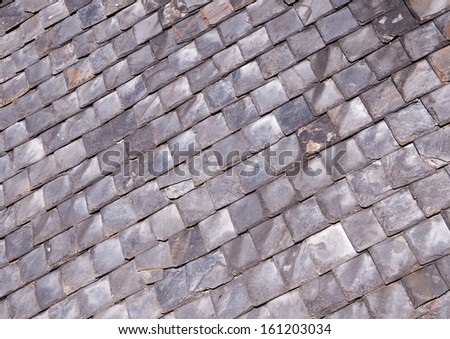 rooftop covered with old gray slate shingles