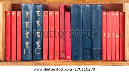 books on the shelf - red and blue - wallpaper