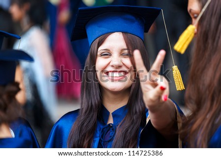 Image of a happy young graduate - outdoor shot