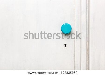 Closeup of an old door wardrobe knob and key hole. Empty space for text.