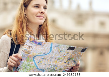 Young beautiful woman traveler with map.