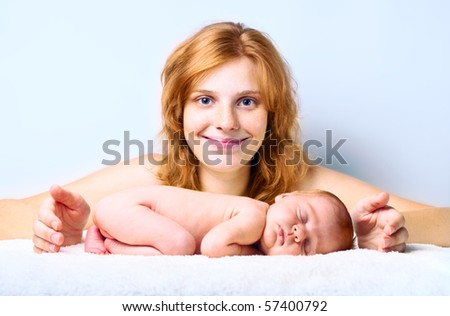 Young happy mother with newborn baby