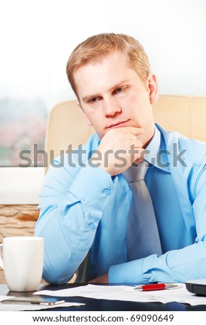 portrait of a young  thoughtful businessman in doubt about something