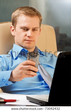 Young businessman with phone