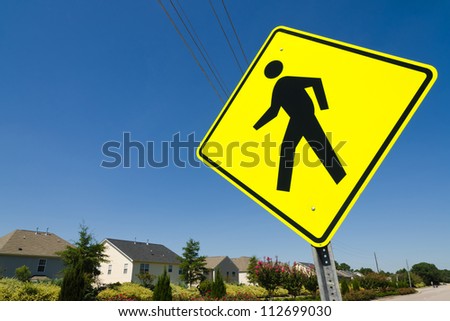 Pedestrian crossing street sign in residential neighborhood