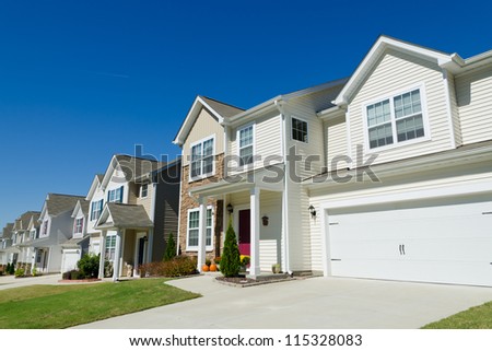 Street of residential houses with vinyl siding
