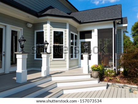 Back deck and screen porch of the residential house