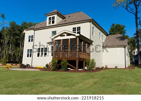 Large residential house with backyard porch and patio