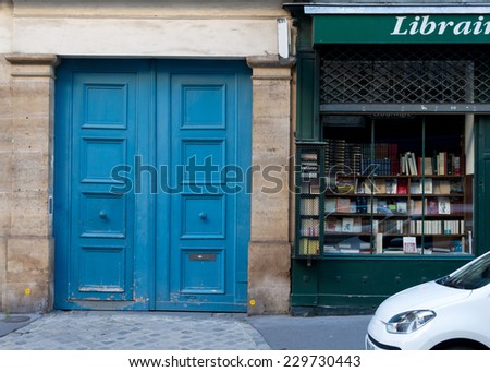 Wooden arch entry door and book store front - Paris, France
