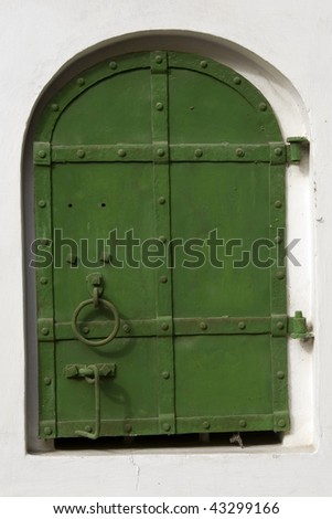 Old green metal window shutter