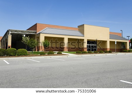 Generic retail  hardware store building with parking lot