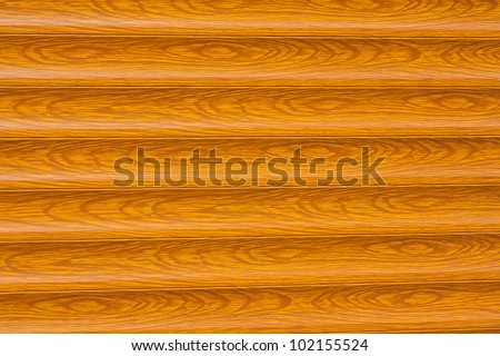 A rolling gate with wood grain slats