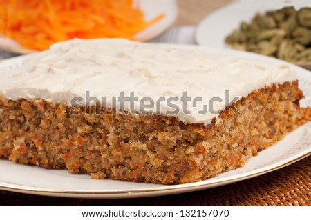 Oriental carrot cake with marscapone and brown sugar topping. With grated carrot and cardamoms.