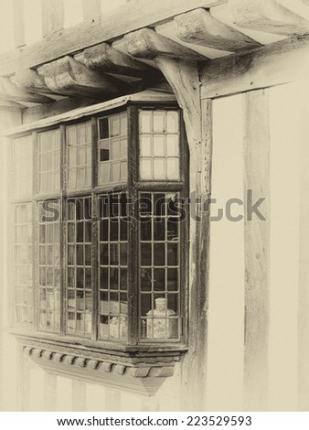 Medieval leaded bay windows from an English half-timbered black and white Tudor house in Lavenham, Suffolk England.  Sepia antique look photo.