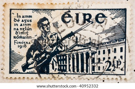 IRELAND - CIRCA 1941: A stamp printed in the Republic of Ireland showing a soldier in front of the General Post Office during the Easter Rising, circa 1941.