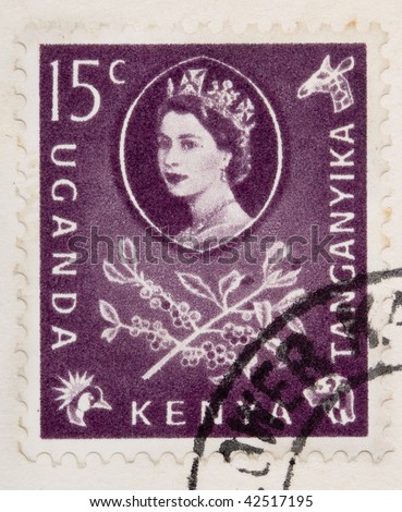 CIRCA 1960: A stamp printed in East Africa from a first day cover of an animal and plant series  showing an image of a branch with coffee berries and leaves, circa 1960.