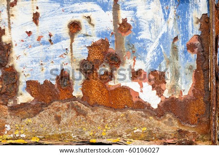 Rusted and very corroded painted metal from a wrecked fishing boat for grunge backgrounds